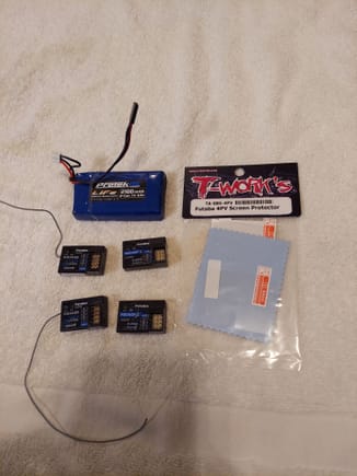 All 4 recievers,  lipo pack for radio, and spare screen protector 