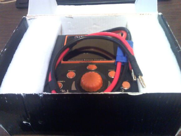 Charger comes in original container with original packaging materials.  Has the power connection with 4mm bullets.  Battery connection cables not included as I think it best for you to get the ones you need.  No CD manual, but I can send you a file when you buy.  Price is $225 + shipping