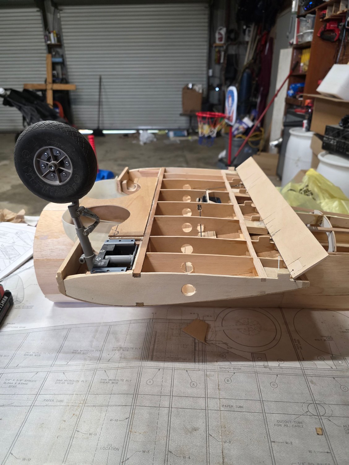 After all is set and cotrol rods are hooked up. half the hinge is glued and set.into the flap itself with the other half only pin into the hinge blocks until a later date.