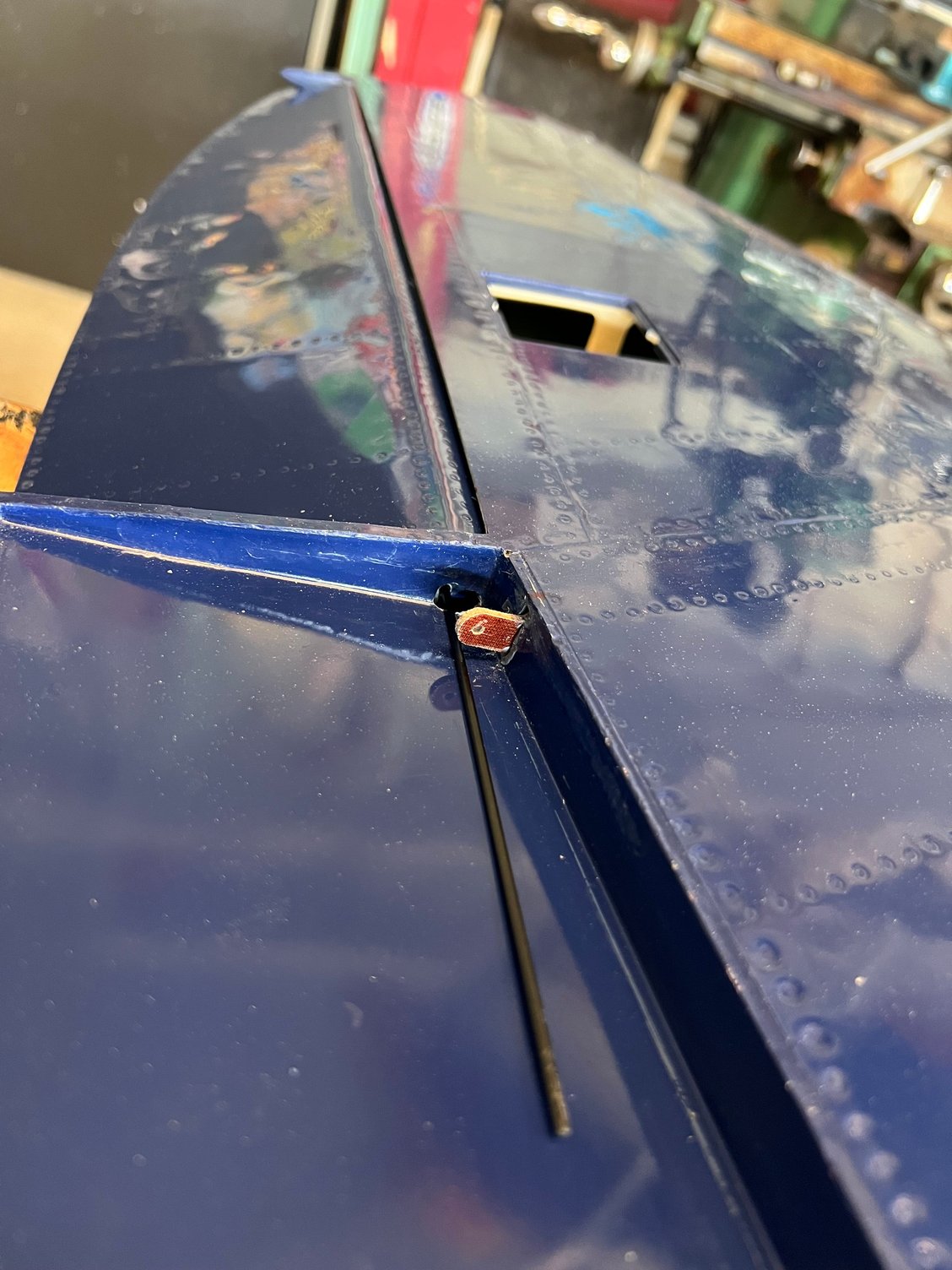 Fortunately, the aileron axle rod passed UNDER the flap hinge for easy removal.