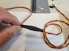 Heat was applied and now I have a connector that is secured.  In the future, should you need to separate the connector. a razor blade will easily slice through the heat shrink.