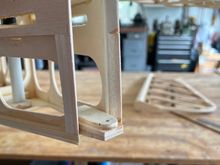 I started by adding balsa pieces to the rear outsides of the fuselage. then you'll see I installed the bottom hinge bracket on a balsa wedge.