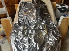 Covered the boat with Aluminum Foil to protect the wood from flame and solder dripping.