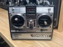 Conquest by Futaba TX. On 50 mHz, fairly a rare radio today. Works like a champ.