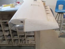 A portion of the wing tip block where the aileron abuts was left elevated.  After the sheeting is applied on the aileron, I will sand to its proper height.