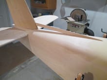 Tapered balsa stock is cut and glued forming the dorsal fin's leading edge.