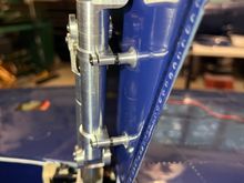 Flush head machine screws go thru doors to strut mounts.  Note the lock nut.  Everything will get locktite of course