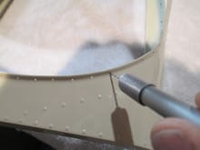A pin vise was used again to remove the paint in each hole.