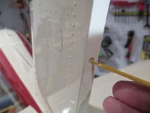 Using a tooth pick, a small amount of epoxy is placed into each of the hinge holes.