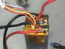 Usually just 1 or 2 pieces of tape need to be removed to expose one side of the inter connect.  I usually remove the black wire first although I have done it the other way but there is a balancing wire attached to the red side.  The metal tab will have to be carefully bent up out from between the 2 cells.  Yellow tape wraps all the way around the tab.