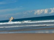 Low pass over the surf.