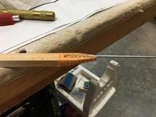 The pushrod end is finished: glued in, wrapped with carpet thread, and glued again.