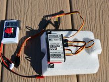 G-rate sensor in the middle, altimeter/variometer below, data logger above, small 2s battery left.