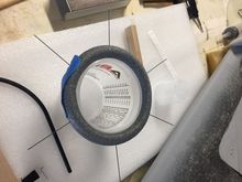 Pic of the foam core, I think 5/8" diameter, sitting on top of a plastic cup to keep it round. I've stuck it with .032 wires, which will suspend the core in the mold. (In theory!) 