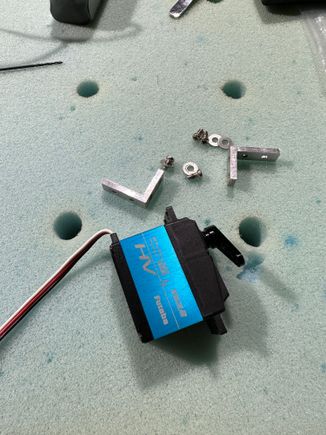 Leading edge flap servo and hardware, L bracket supplied were for a micro servo, luckily I had extra from the 2.5m Viper wreckage. So L bracket, four screws with washers and four would screws to attach to the wood mount