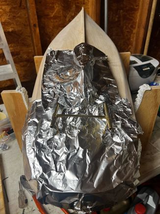 Covered the boat with Aluminum Foil to protect the wood from flame and solder dripping.