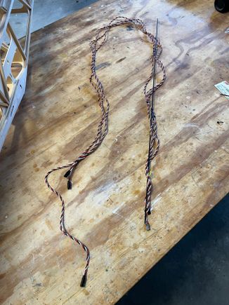 Here's the three tail extensions on a carbon rod to feed them forward.  This all can be done after cover but much easier now.