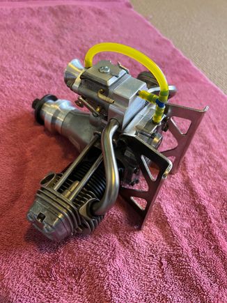 Pressure pulse exits the crankcase straight into the intake manifold while waste oil heads to the intake venturi.  Neat and clean.