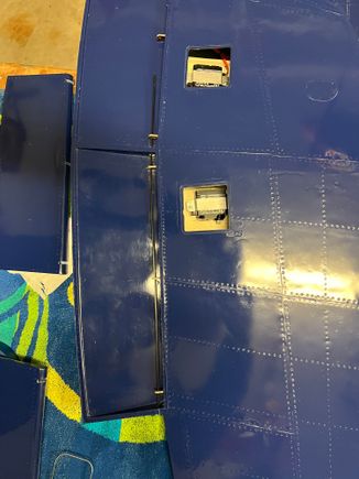 Here’s the flap rod arcing thru the hinges