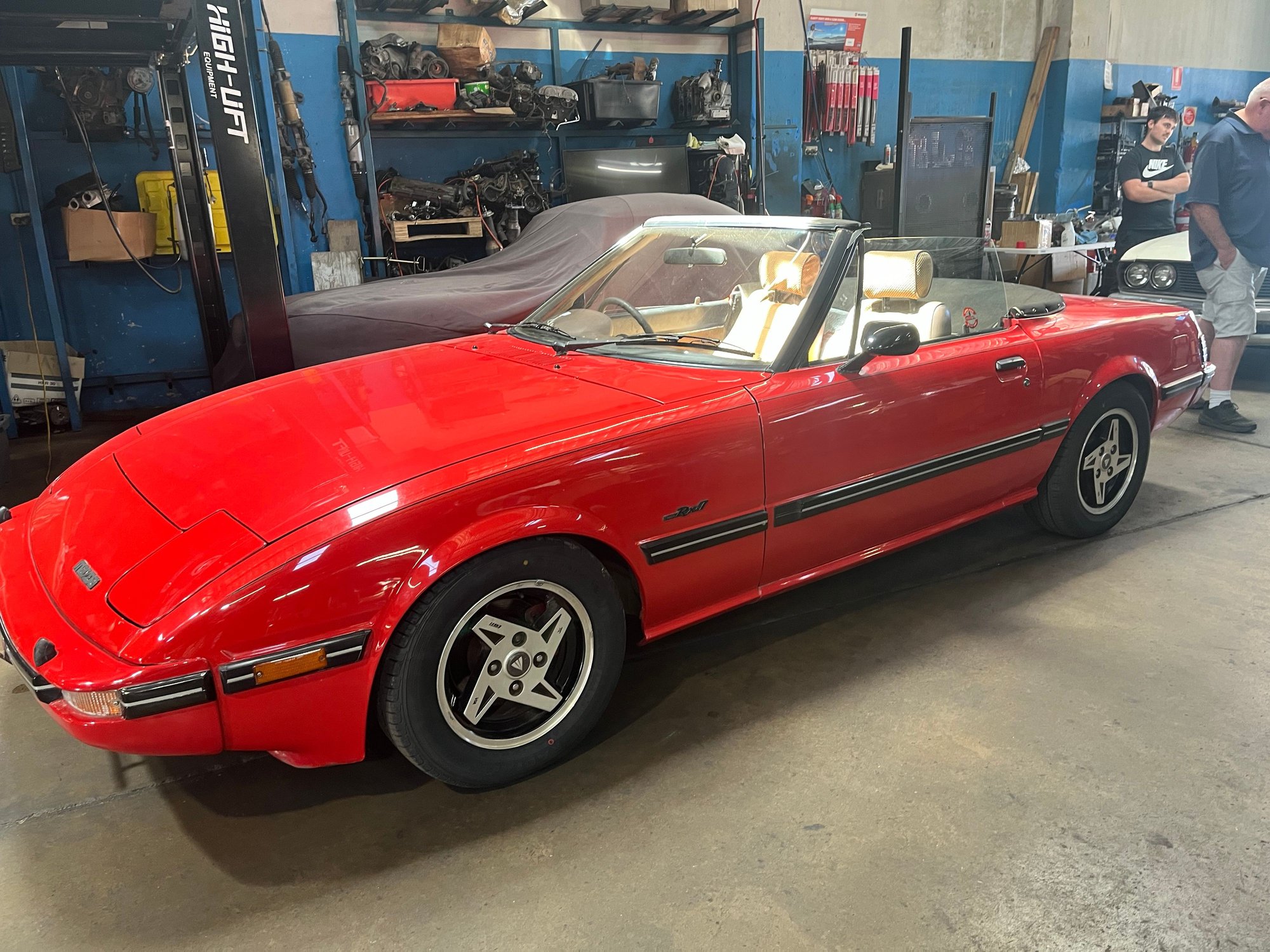 Meet Breezy, a 1985 Mazda RX7 convertible built by Mazda Australia and sold by City Mazda Adelaide as a convertible with warranty.  It is car number 6 of 6 built with the number appearing on a plaque in the engine bay together with compliance with ADRs. It is to receive a new exhaust system with Rotaflo muffler and silencer and a new softop will be fitted.  The car sat stored for 10 years prior to purchase. It has a 12A turbo engine and gearbox and upgraded breaks.