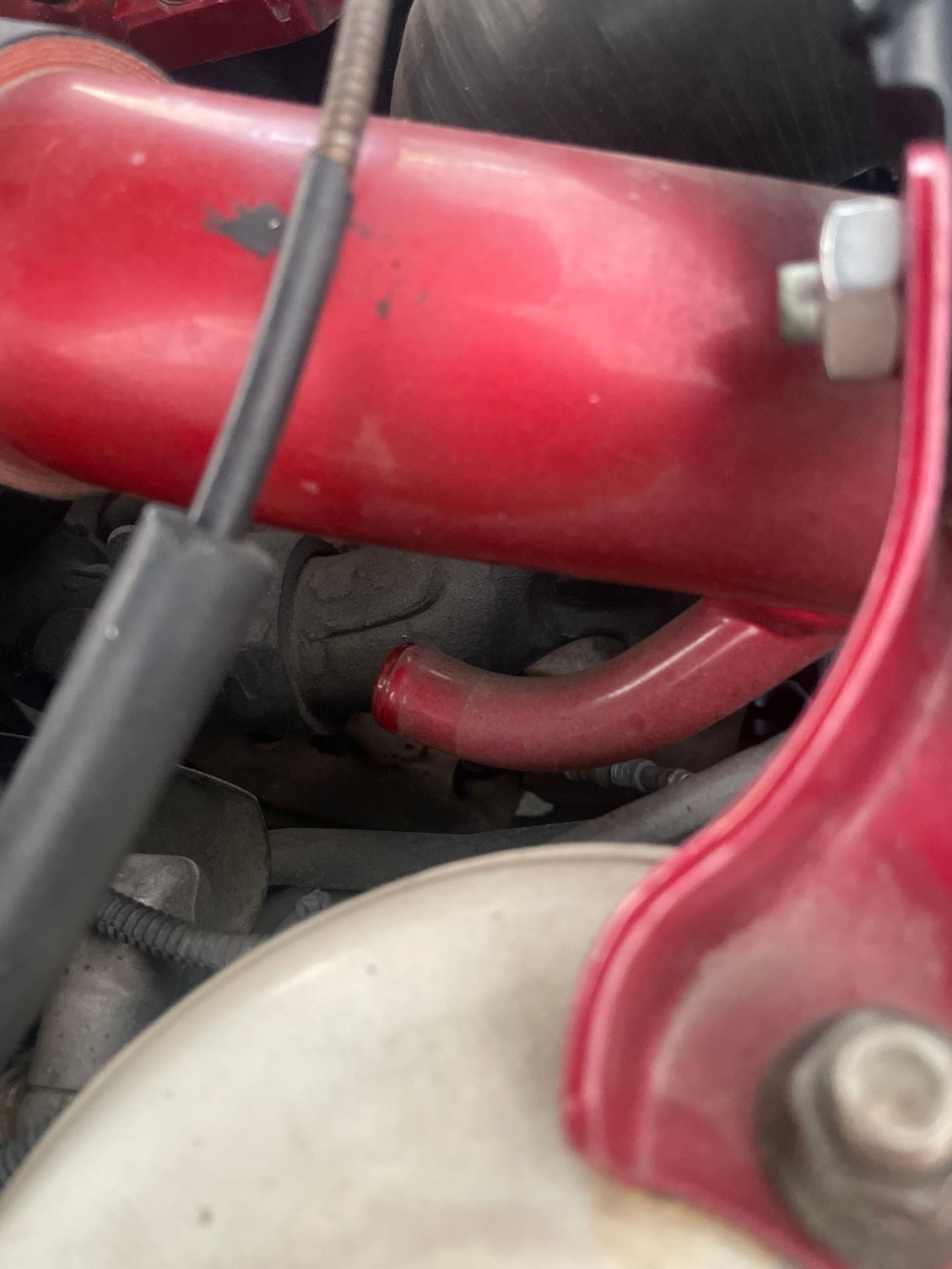 What is this red pipe coming off my intake? I wanted to know if it has to be plugged or not on my FD. I have a v mount set up and I bought the car after mods and I�m so lost to what this is, I have been having major boost leaks as well so I wasn�t sure if this could have an affect or not , please don�t call me stupid I know I just really like the car and trying to understand it better