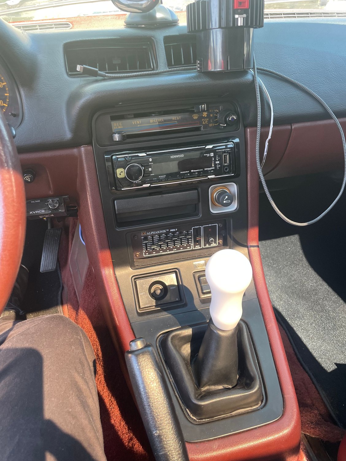 Here�s the finished setup. My �83 came with the oem mini pistol grip shift **** that I have never liked. I was trying to buy an oem 84-85 one but the people on eBay were asking a ridiculous amount for the condition they were in. I ended up finding the proper thread pattern with Torque Solutions and am very happy with it. The material does not get hot or cold which is similar to the AMS brand one I run in my rx8.