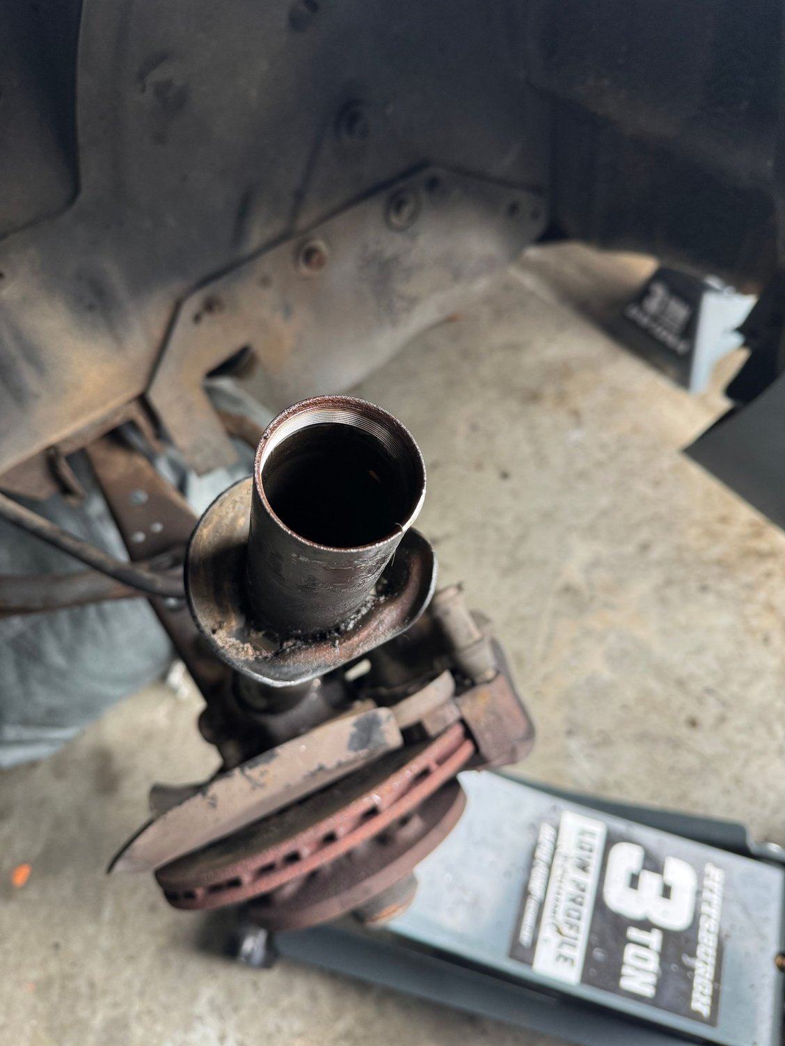 Pull the old shock out of here.