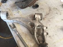 Lower control arm removed from the knuckle.