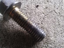 Also, random, my lower starter bolt.  this is the exact one that came out of the car, however what worries me is it might have been the wrong bolt put in by a previous owner, note the grey on the bottom end?  It threads in by hand by quite a few turns and then the socket gets it the rest of the way, but maybe im just being cautious.