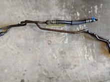 Dual oil cooler lines. Please note the OEM brackets for the lines are not included. The important right side oil cooler line and associated clips are included as seen in the photo. 