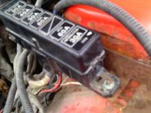 On the bolt that is connecting the main fuse box to the car, the is a red/black wire that was cut? not sure what it is for.