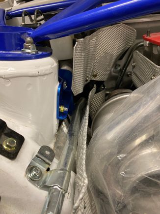 Reinstalled heatshield over the pipe to protect the pipe from the turbo heat as well 