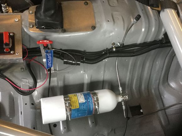 Fire suppression kit with race track fabled mount for release