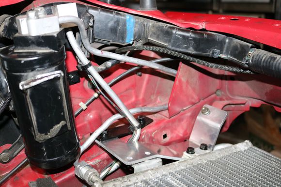 This part was the most time consuming for sure. My friend brought over his tubing bender and we bent the AC line straight and after several bends, unbends, and re bends, we finally got these things to work. I'm getting a spacer to move the drier inboard about 1/2" for more clearance between the sight glass and the wiring harness. Still have plenty of room with the intercooler mocked up as well.