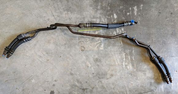 Dual oil cooler lines. Please note the OEM brackets for the lines are not included. The important right side oil cooler line and associated clips are included as seen in the photo. 