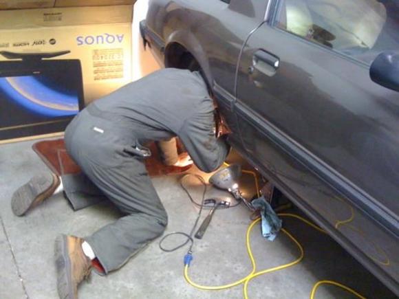 Dad with his head stuck in the rear wheel well.  Great shot, huh.