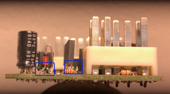 Examine the legs of the transistors inside these 2 blue boxes.