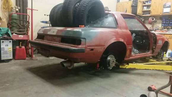 ignore the tires... had to put weight in the rear so when I use a pole jack on the axle it would weigh the car down and not lift allowing me to get the axle up as high as I could and build the system to clear it...