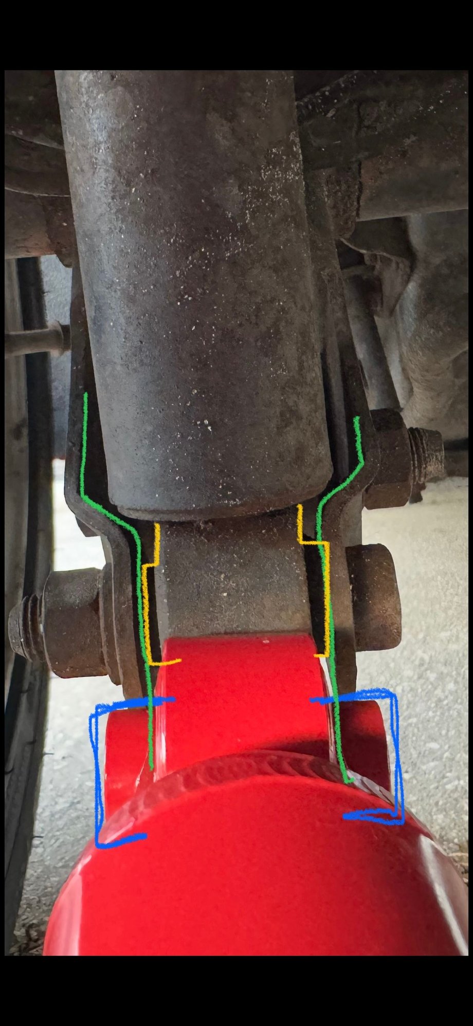 For illustrative purposes, the AGX rears adjustable shock eyes do not fit in the stock mounting location. You need an angle grinder and a metal cutting blade. 