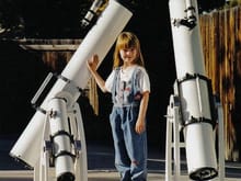 My daughter, ten years ago, modeling some telescopes I built for a magazine article I wrote.