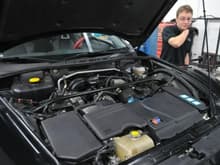 Engine Bay Before. The guy in the picture is Adam from FD3S Engineering.