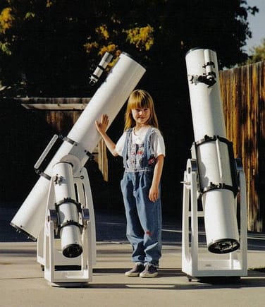 My daughter, ten years ago, modeling some telescopes I built for a magazine article I wrote.