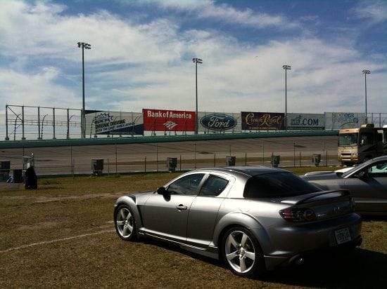 My Rx8 parked within 20 feet   or - from the track itself! Not only that but I could sit in my car and watch the race!!! Best seat in the house if you ask me!
