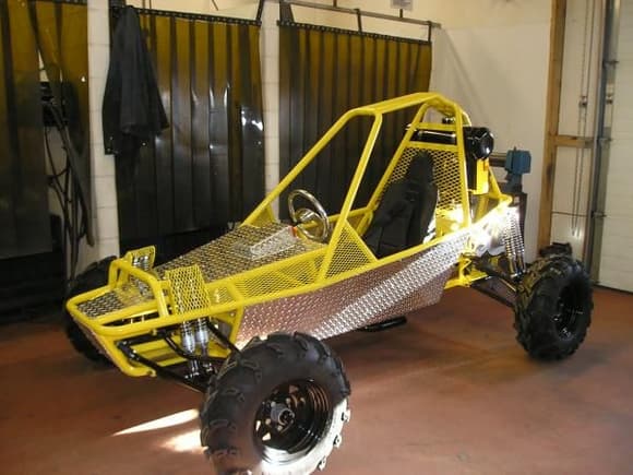 this is a toy that im making at my dad welding shop, got it painted lighting yellow, to match my car!! ,have spent about a month on it, only get about 3 evenings a week to use the shop