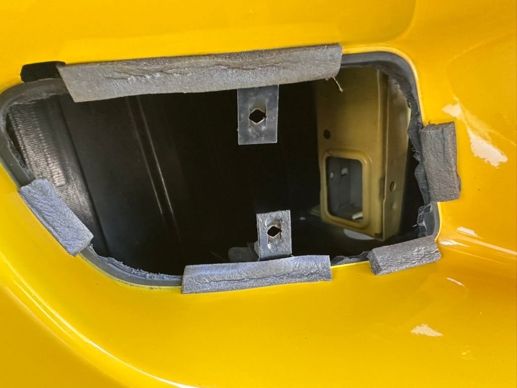 Prior owner had cut out the fake vents. Put some weather stripping to protect the paint. 