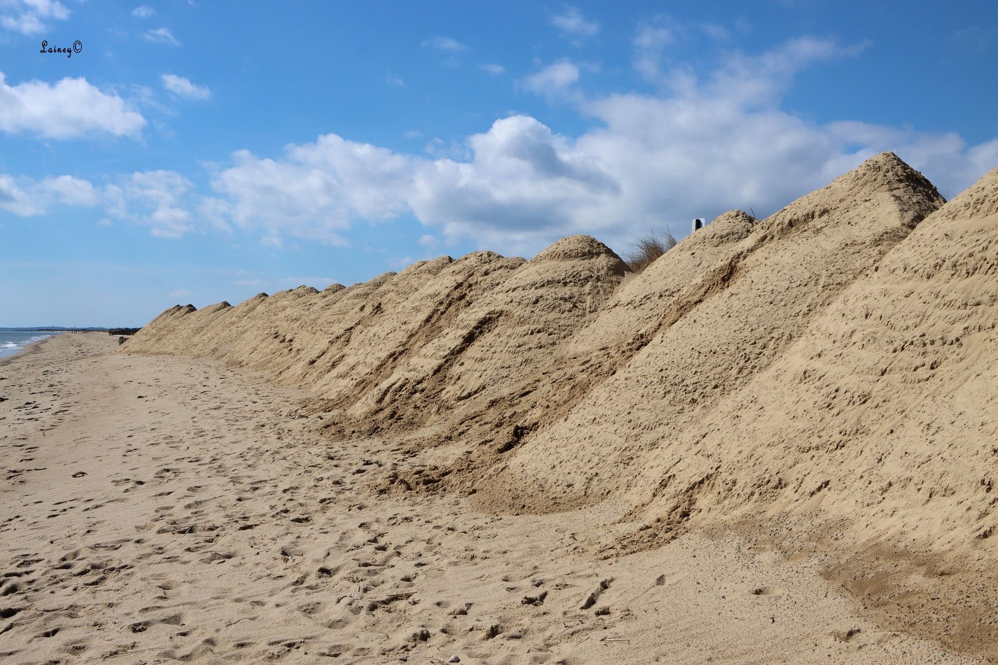 Beach in Mashpee.  Looks like they made pyramids in the sand to protect from erosion?
