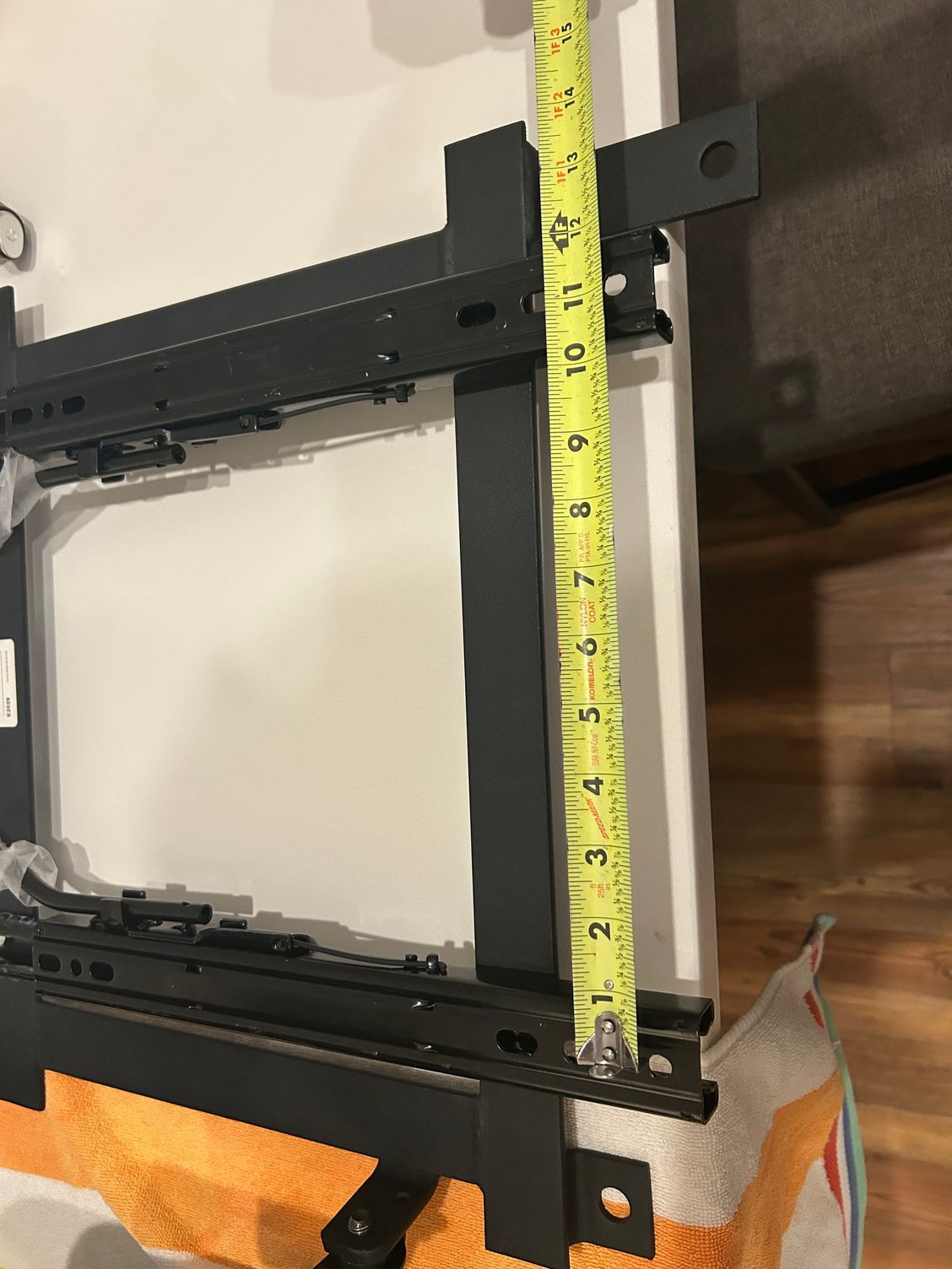 So one of my thoughts was to disassemble the sliders to fit the width of the seats. All I would have to do is rebend the slender bar to make it fit the wider position. Then drill new holes on the frame. Not too bad