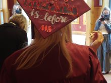 The cityscape in the center of the cap is that of Columbus, location of THE Ohio State University.