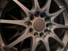 I drove halfway across the state to get these Volks CE28N. Saw them listed for an okay price, these were apparently fitted on a JDM S2000 that was imported. Pretty clean, minor wear. Original bronze. Sticker date codes are 2006 which would make them period correct for my S2000. Staggered setup that did not require fender rolling. What's more interesting is that the hub was bored out to S2000 sizing so I didn't need hubcentric rings. The center caps are probably aftermarket. 