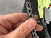 When you get to the end, stretch the wiper insert so that the metal tab fully seats into the slot. At this point, it should be locked in and will not fall out.